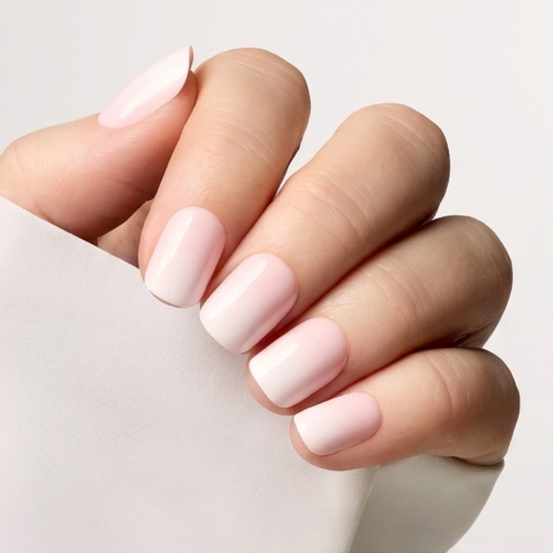 Square French Ombre soft pink press-on nails on hand